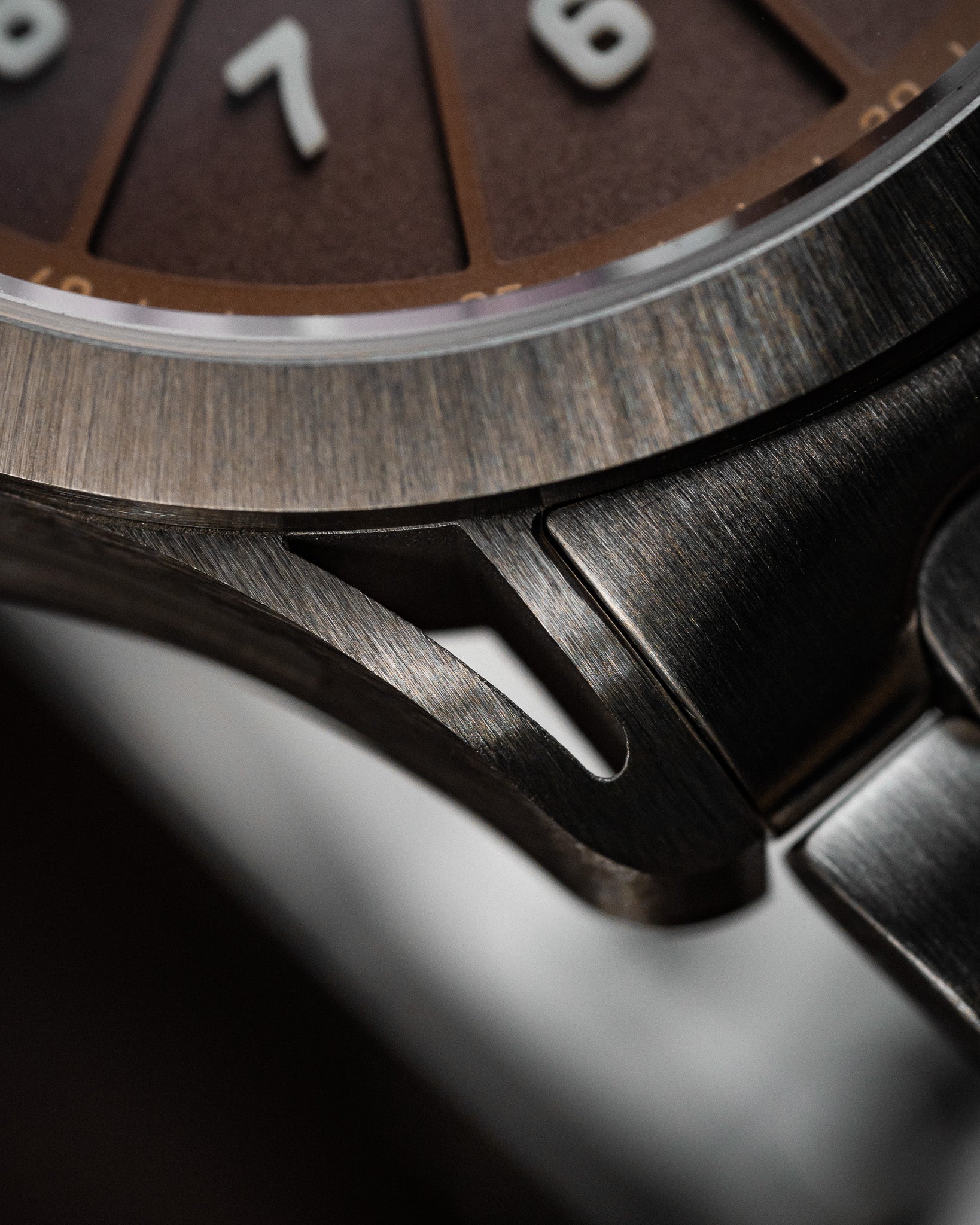 Close-up of SLOMO Watches Glance automatic watch skeletonized lugs.